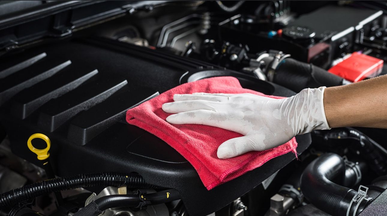 Cleaning engine bay of car 